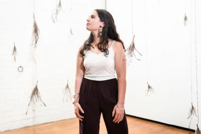 Graduating Visual Art Honours student Moorina Bonini, with her work The Other Reclaims. Photo by Giulia McGauran.