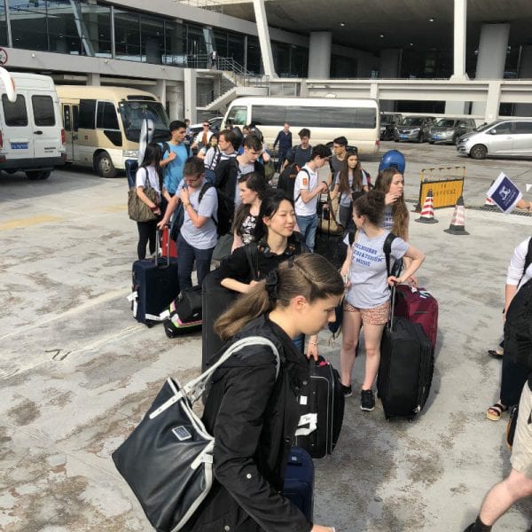 University of Melbourne Symphony Orchestra players emerge from Shanghai’s Pudong International Airport. By Paul Dalgarno.