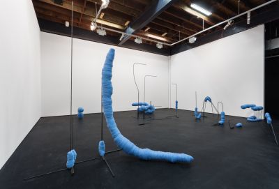 Install image of blue sculptures in a gallery     