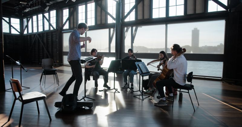 Melbourne Conservatorium of Music string ensemble students practicing with the Australian Chamber Orchestra during a training intensive in Sydney.