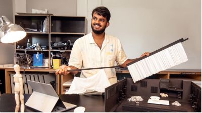 Ishan Vivekanantham stands in a studio