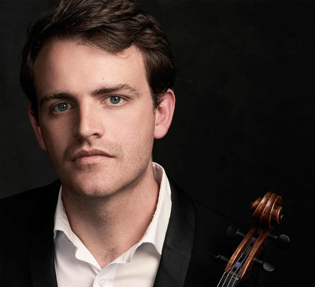 A man holds a viola