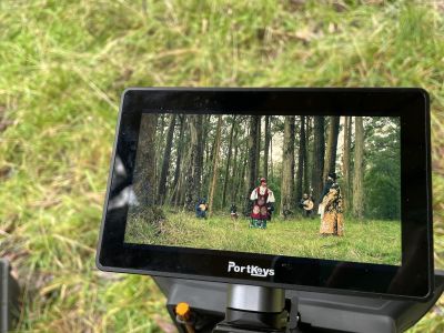 A video camera display against grass