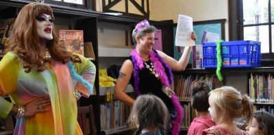 Drag queens reading to children in a local library