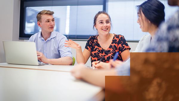 Students talking sitting in classroom