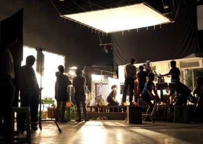 A group of people work on a film set